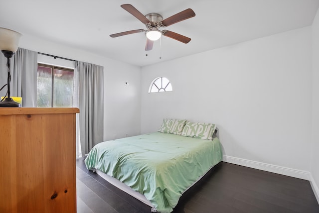 bedroom featuring dark hardwood / wood-style floors and ceiling fan