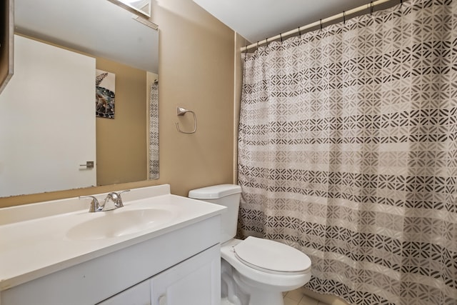 bathroom featuring walk in shower, vanity, and toilet