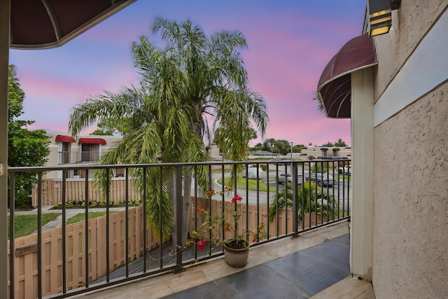 view of balcony at dusk