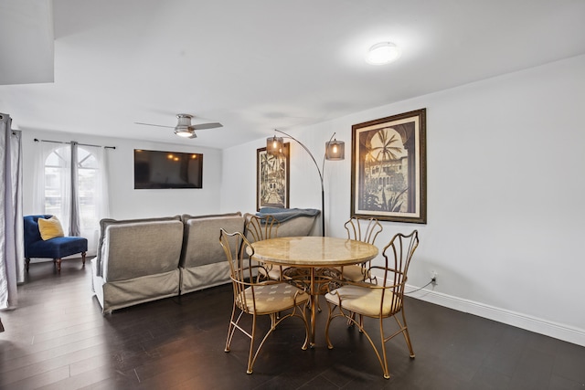 dining area featuring dark hardwood / wood-style flooring and ceiling fan