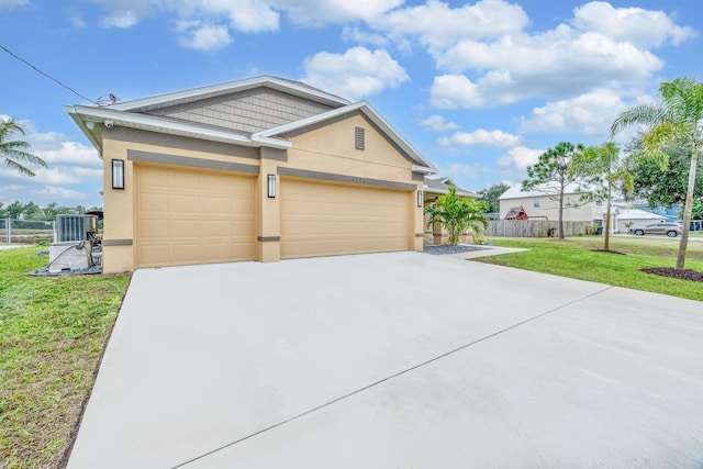 1316 SW Abacus Ave, Port Saint Lucie, FL 34953 - view of front of home featuring stucco siding, driveway, an attached garage, and central AC unit