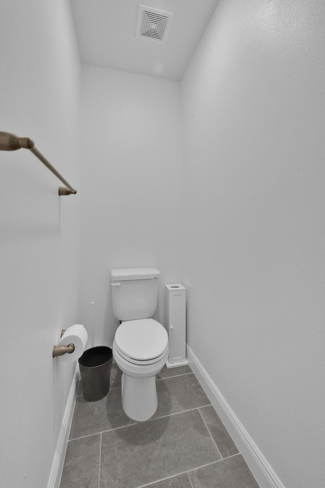 1316 SW Abacus Ave, Port Saint Lucie, FL 34953 - bathroom with toilet, tile patterned flooring, and baseboards