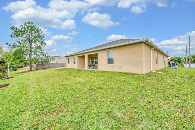1316 SW Abacus Ave, Port Saint Lucie, FL 34953 - back of property featuring stucco siding and a patio area