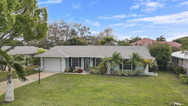 ranch-style home featuring a garage and a front lawn