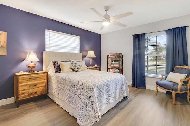 bedroom featuring ceiling fan and hardwood / wood-style floors