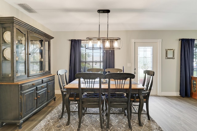 dining room with dark wood-type flooring