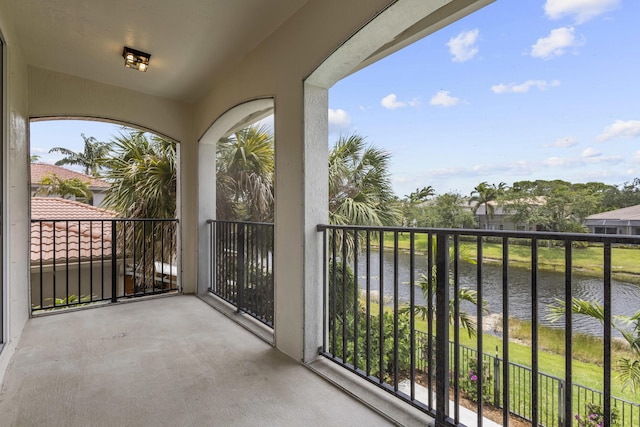 balcony featuring a water view