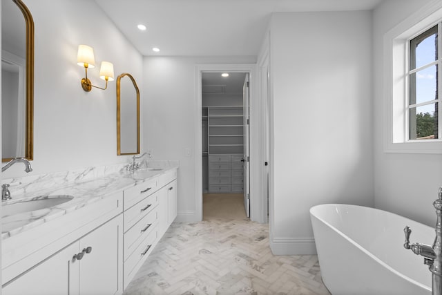 bathroom with vanity and a bathtub