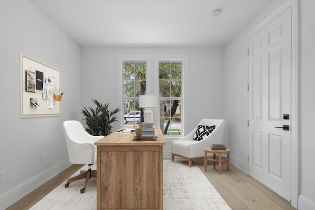 office area with light hardwood / wood-style floors