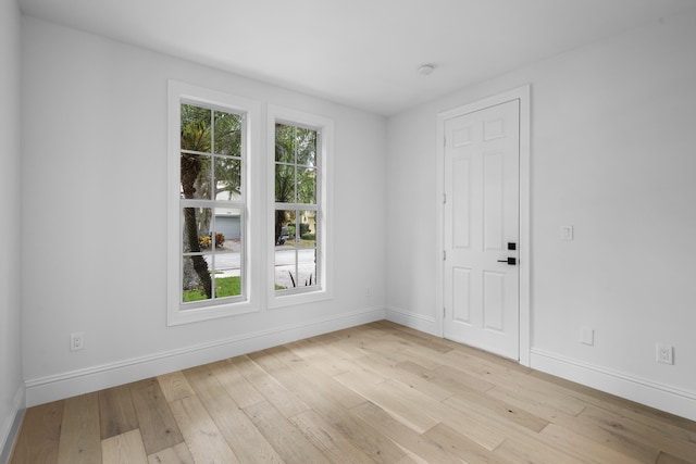 unfurnished room featuring light hardwood / wood-style floors