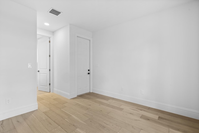 spare room featuring light hardwood / wood-style floors