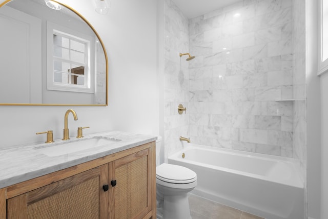 full bathroom featuring vanity, toilet, and tiled shower / bath