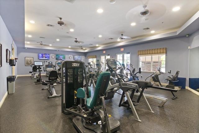 gym featuring a tray ceiling