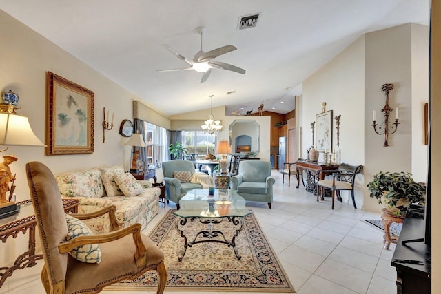 living room featuring light tile patterned floors, ceiling fan with notable chandelier, lofted ceiling, and visible vents