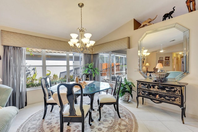 dining space with lofted ceiling, tile patterned flooring, and a notable chandelier