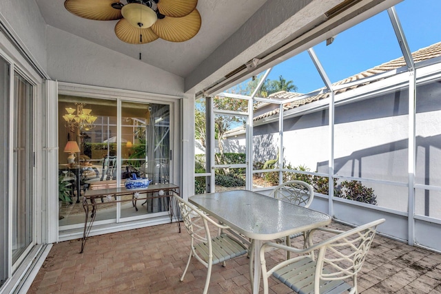 sunroom featuring lofted ceiling