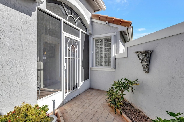 doorway to property featuring a patio