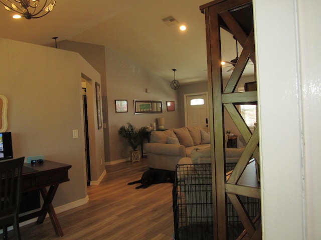 living room with lofted ceiling and hardwood / wood-style floors