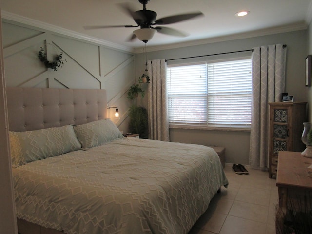 bedroom featuring crown molding, ceiling fan, and tile patterned floors