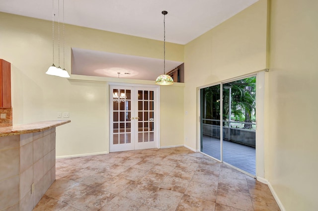 unfurnished dining area with french doors