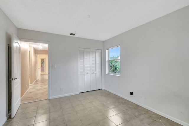 unfurnished bedroom with a closet