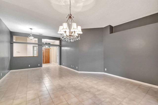 interior space featuring a notable chandelier and a textured ceiling