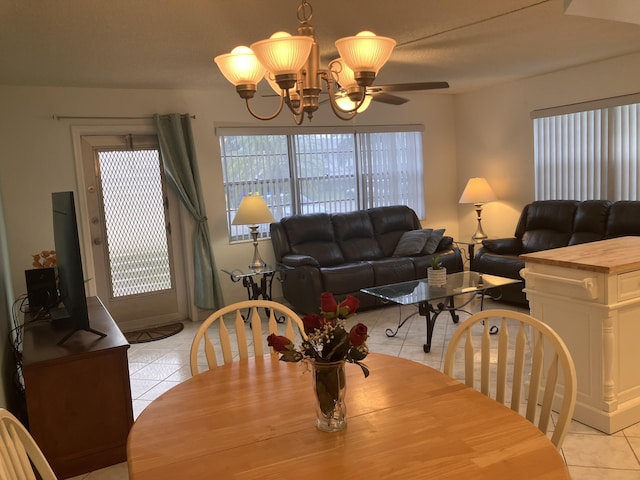 dining room with an inviting chandelier and light tile patterned floors