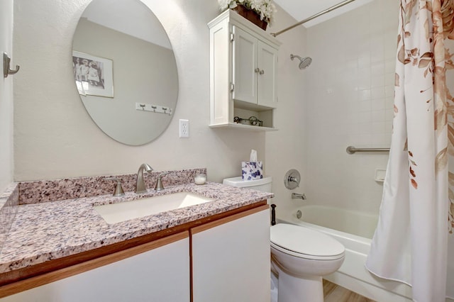 full bathroom featuring vanity, hardwood / wood-style floors, shower / tub combo with curtain, and toilet