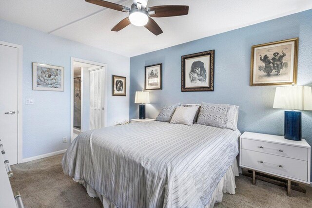 bedroom featuring light colored carpet and ceiling fan