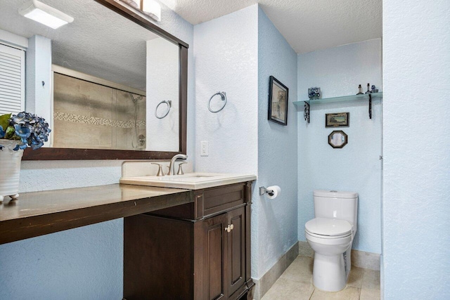 bathroom featuring vanity, tile patterned floors, a textured ceiling, and toilet