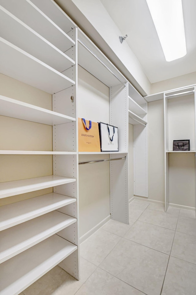 spacious closet with tile patterned flooring