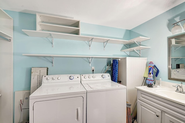 laundry area with separate washer and dryer and sink