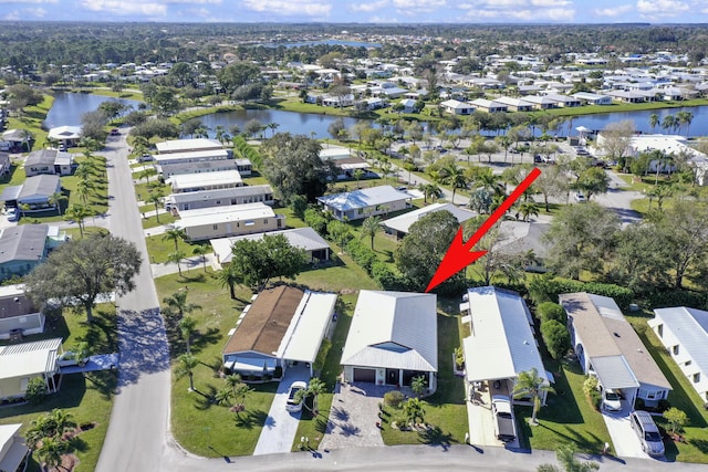 aerial view featuring a residential view and a water view