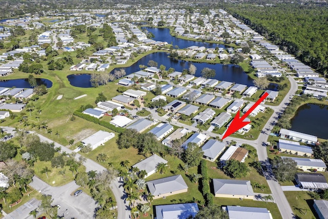 birds eye view of property featuring a water view and a residential view