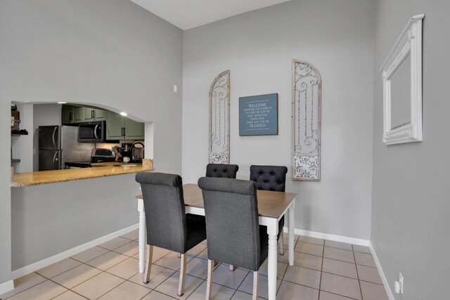 dining area featuring light tile patterned floors