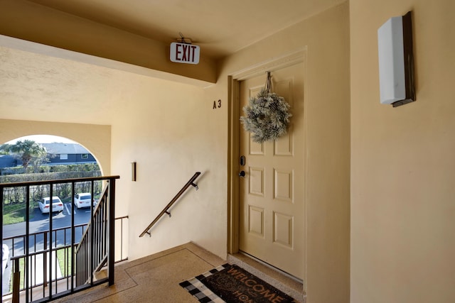 entrance to property with a balcony