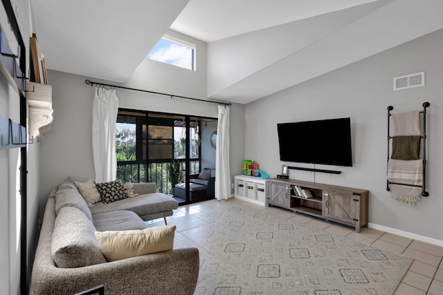 tiled living room with vaulted ceiling