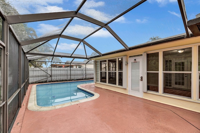 view of pool with a lanai and a patio area