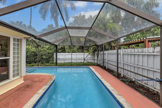 view of pool with a lanai