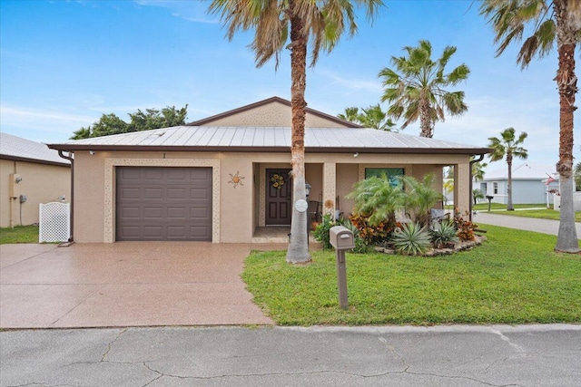 view of front of house featuring a garage and a front lawn