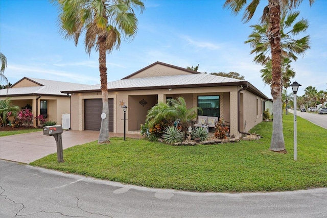 single story home with a garage and a front lawn