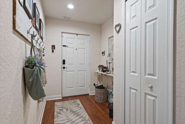 entrance foyer featuring dark hardwood / wood-style flooring