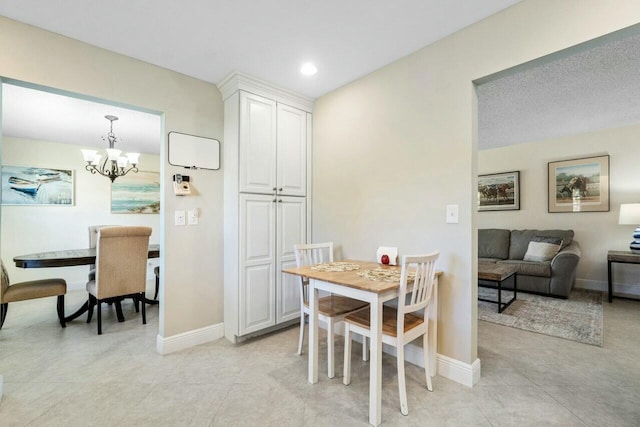 dining area with a notable chandelier