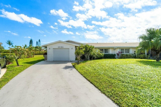 single story home featuring a garage and a front lawn