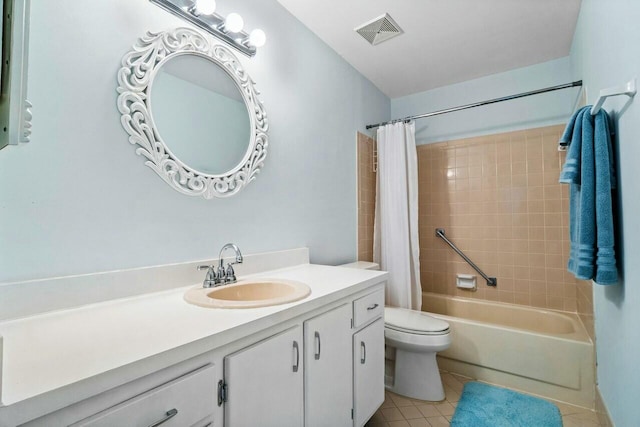 full bathroom with vanity, tile patterned floors, toilet, and shower / bath combo with shower curtain