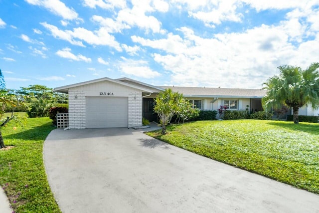 ranch-style home featuring a garage and a front yard