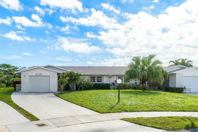 ranch-style home with a garage and a front lawn