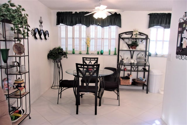 tiled dining room with ceiling fan