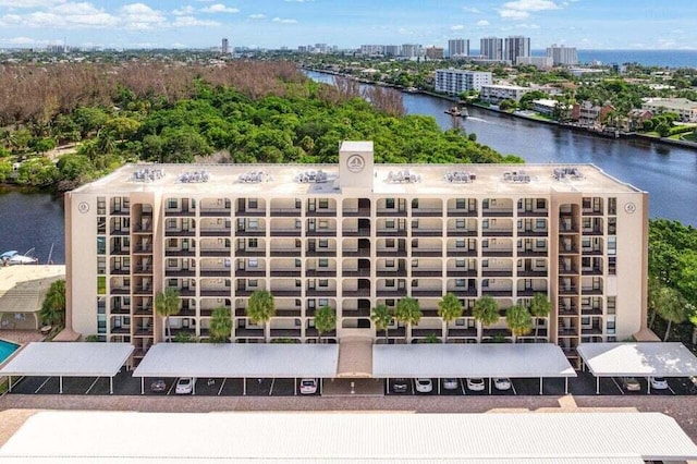 birds eye view of property with a water view