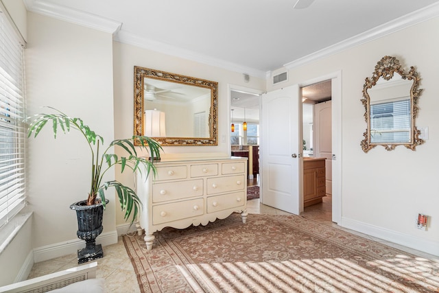 tiled bedroom featuring multiple windows and ornamental molding